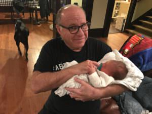 grandparenting Grandpa holds grandson